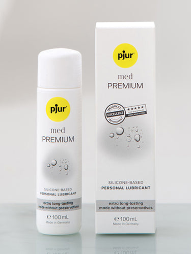 Bottle and packaging of pjur med Premium silicone-based personal lubricant on a gray background